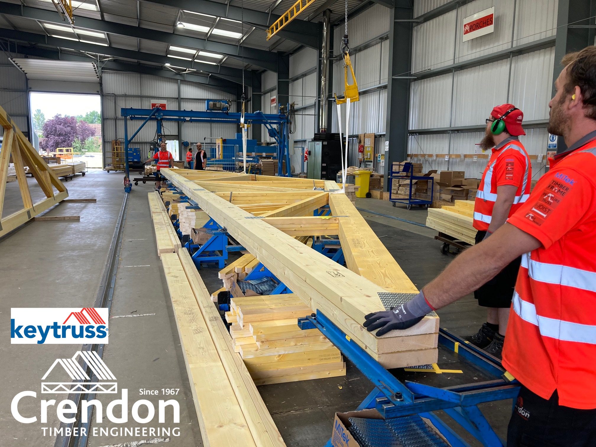 16m 3 Ply Factory Nailed Girder Trusses in production this week at Crendon East Harling all with bespoke designed metalwork fixings for New Stores, Training and Educational Facility in Haddenham