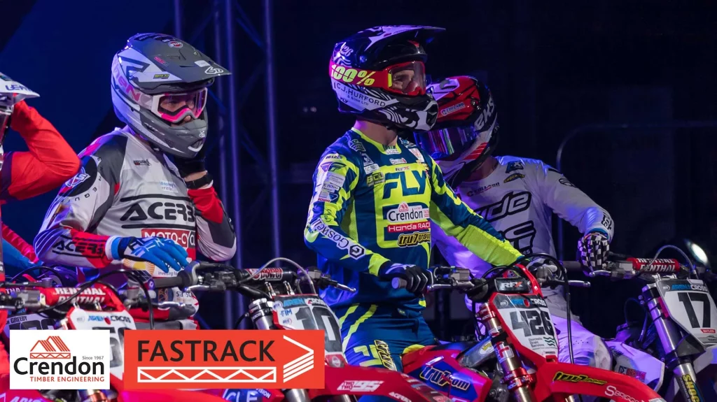 Motocross riders lining up at start of race