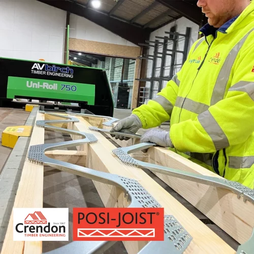 Men in warehouse with high vis jacket on handling posi-joist structure