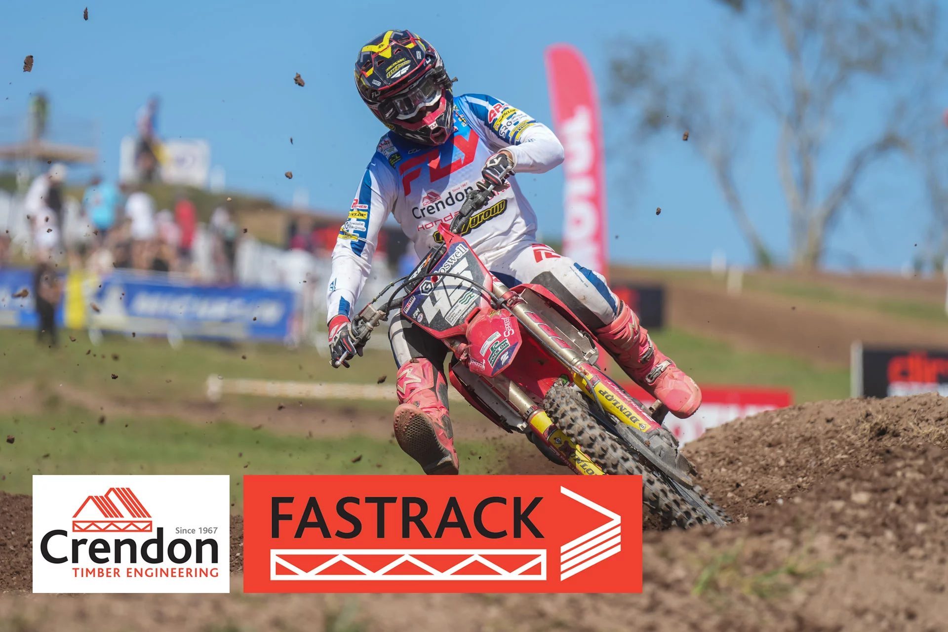 3 motocross riders on a dirt track.