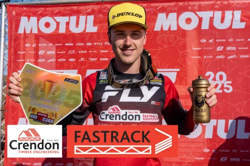 Motorcross rider winning with plaque