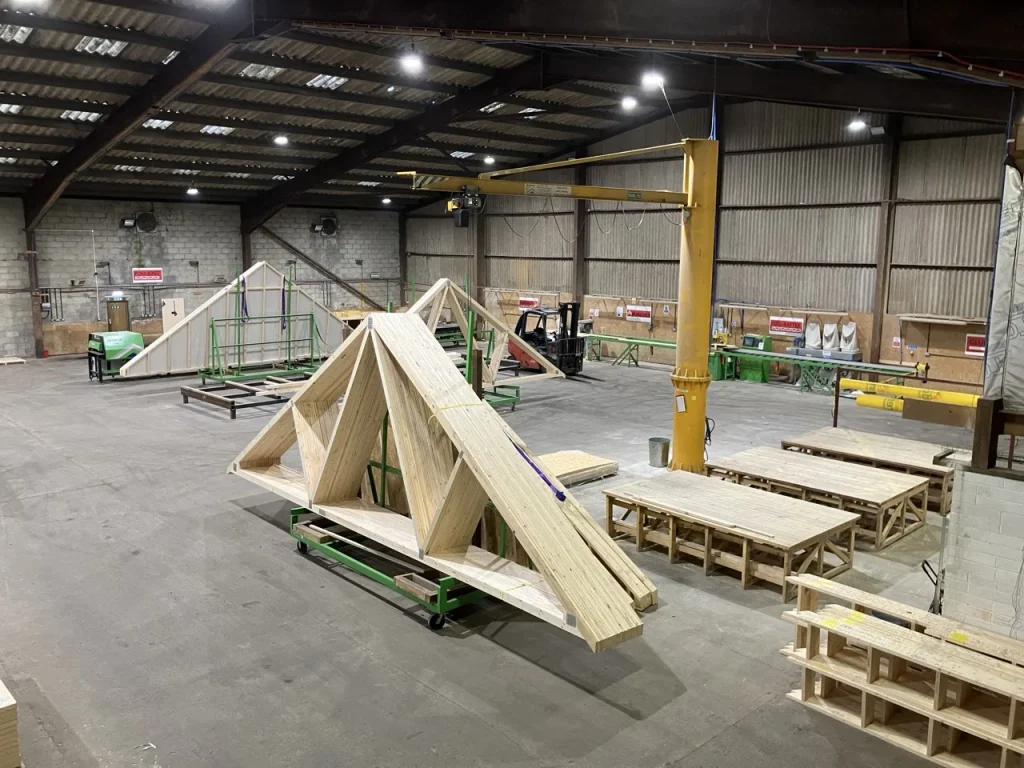 Inside of a timber factory with roof trusses