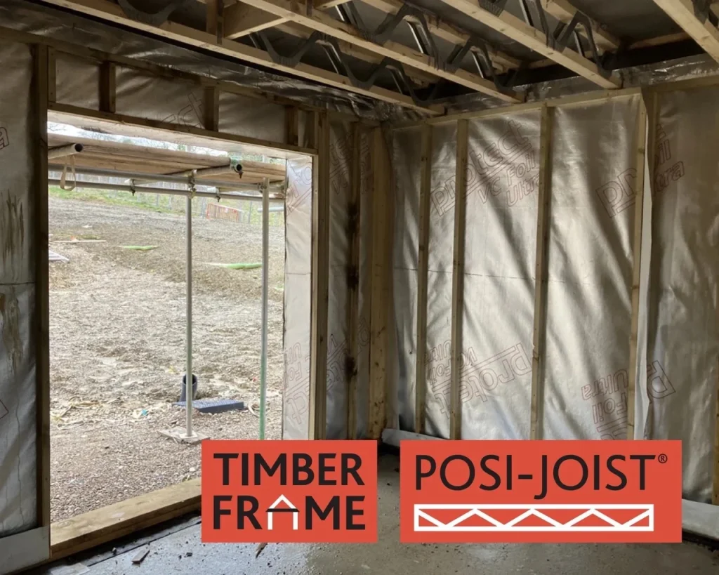 Inside of a room under construction with Posi-Joists forming the ceiling