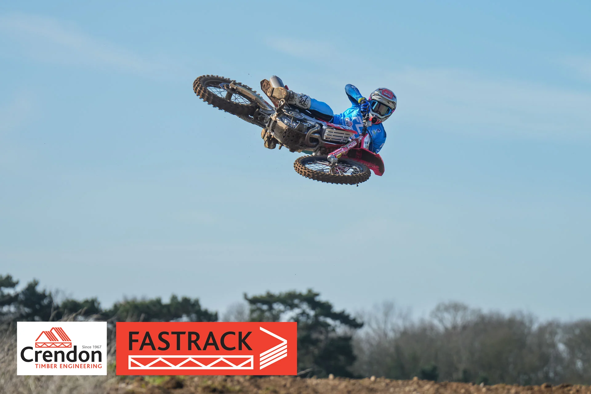 A biker in the air on his bike.
