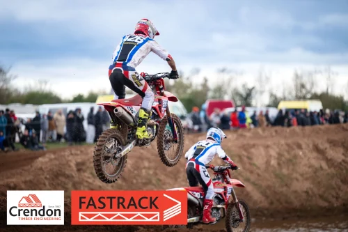 A motocross biker up in the air. 