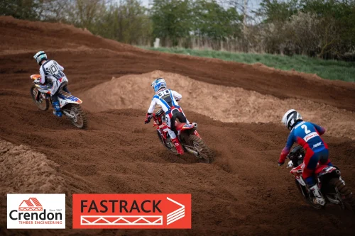 3 motocross riders on a dirt track.