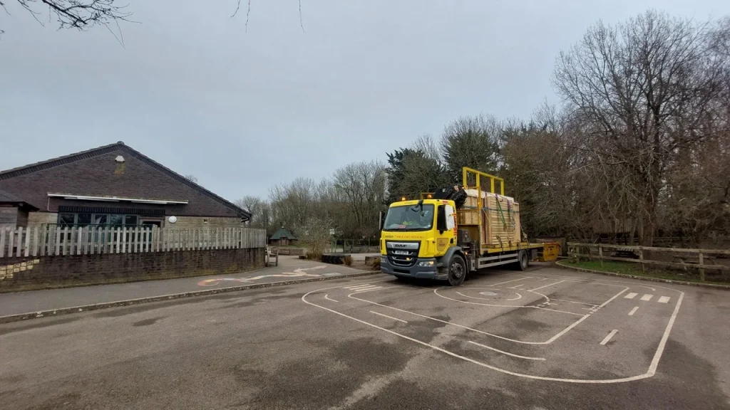 Crendon lorry loaded with materials parked on a playground