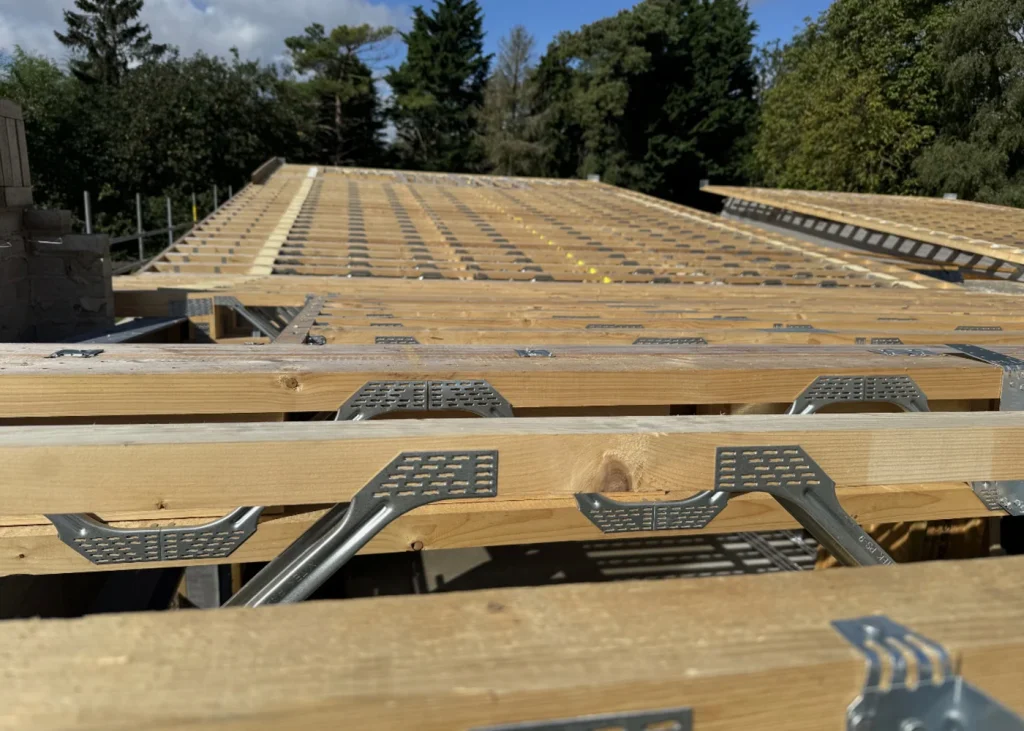 Posi-Joists across the top of a building under construction