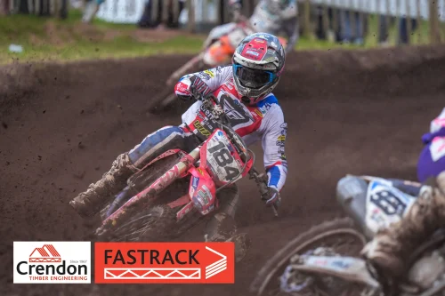 A motocross biker going round a dirt bend.