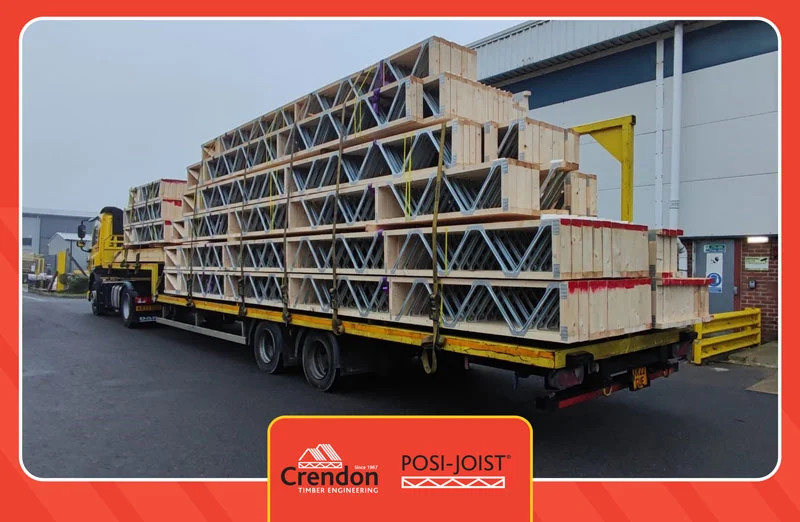 Lorry loaded with Posi-Joists in front of a warehouse