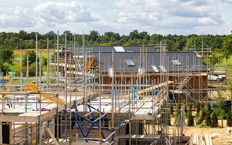 Building under construction covered in scaffolding