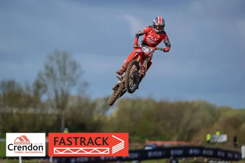 A motocross rider up in the air.