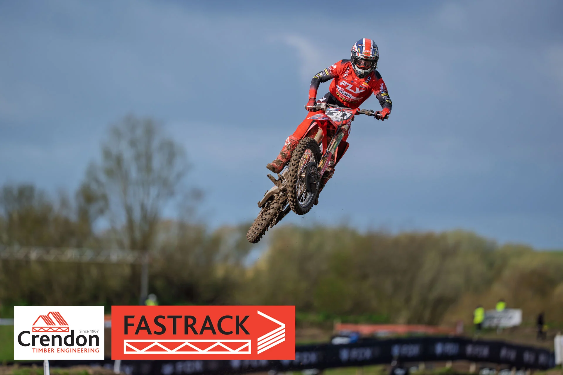 Motorcross rider mid-jump in the air