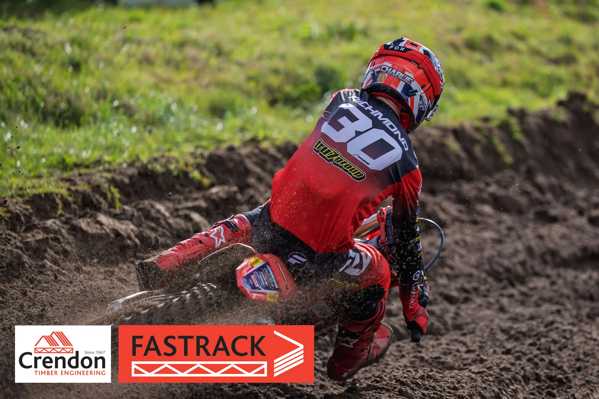 a motocross rider going round the corner on a dirt bike.