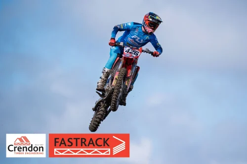A motocross rider up in the air.