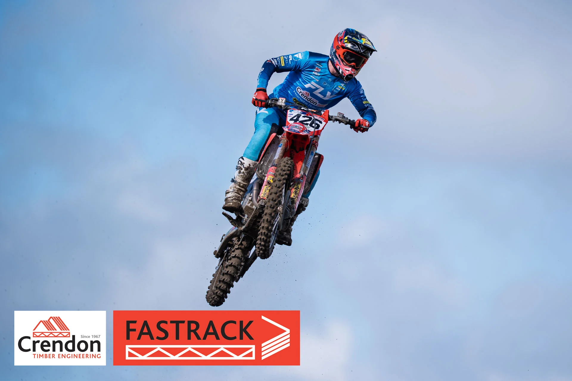 A motocross rider up in the air.
