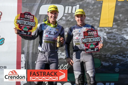 Two of the Crendon FASTRACK Honda riders standing side by side together on the podium.