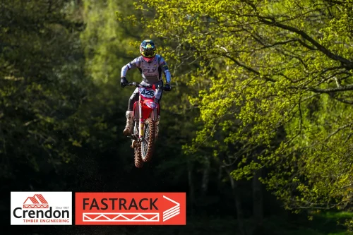 A motocross biker up in the air.