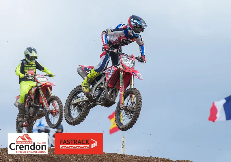 Men on bikes in the air mid-jump
