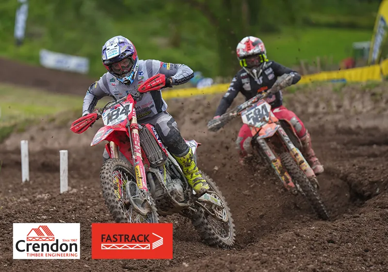 2 men on bikes on dirt track