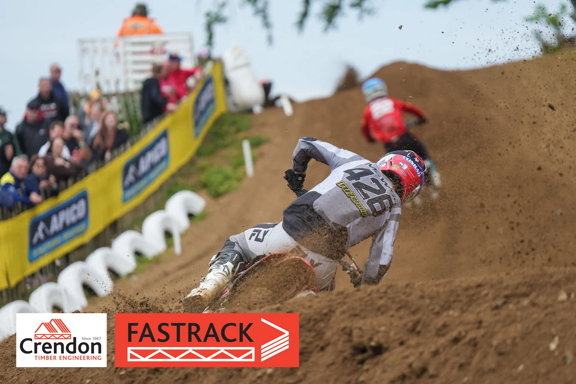 A behind shot of a rider on his bike on the track.