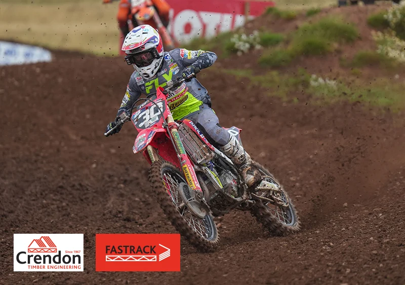 Red Dirt Bike and Rider on Course