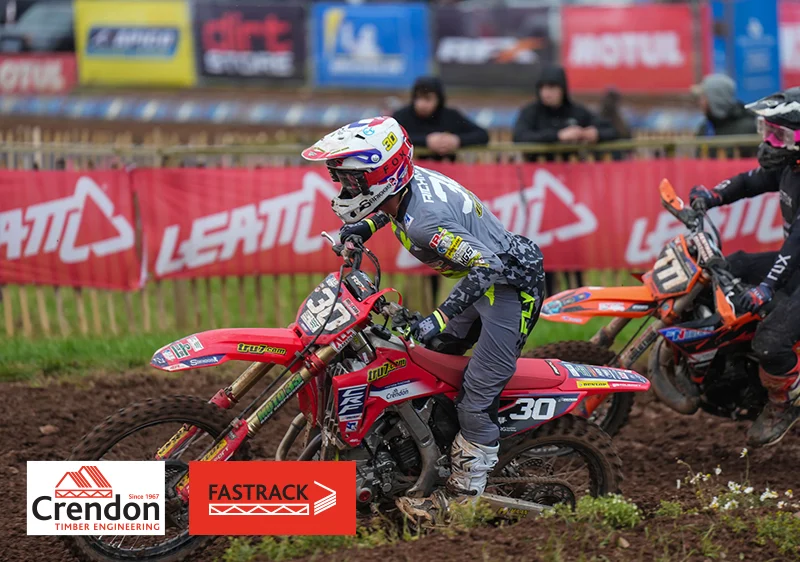 Red Dirt Bike and Rider on Course