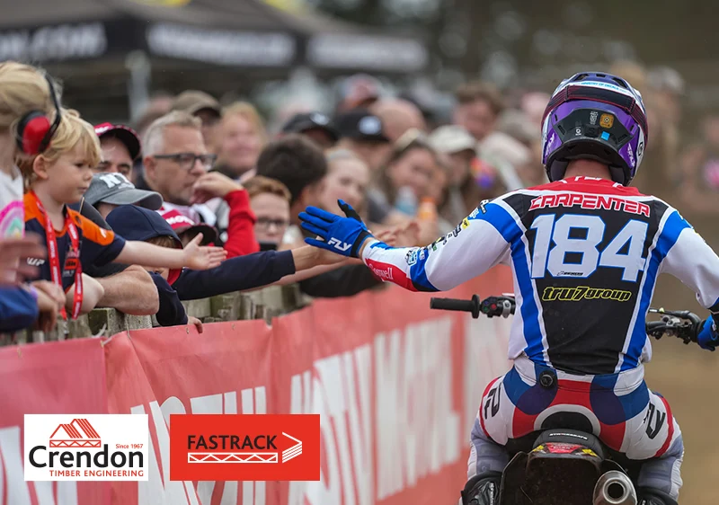 Rider interacting with crowd as he passes by